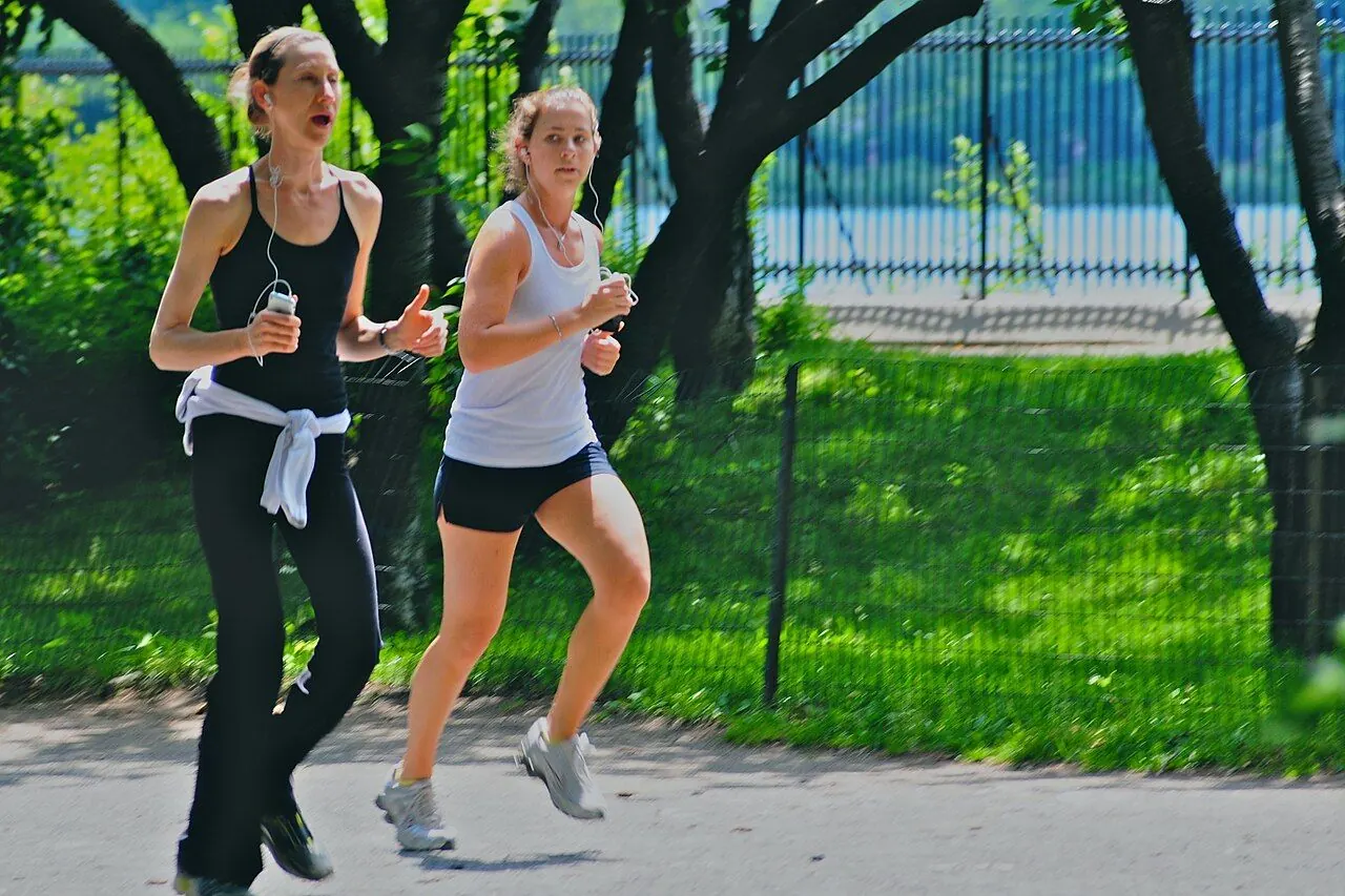 Beginner runner jogging along a park path